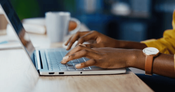 Person using a laptop to manage Smart Forms