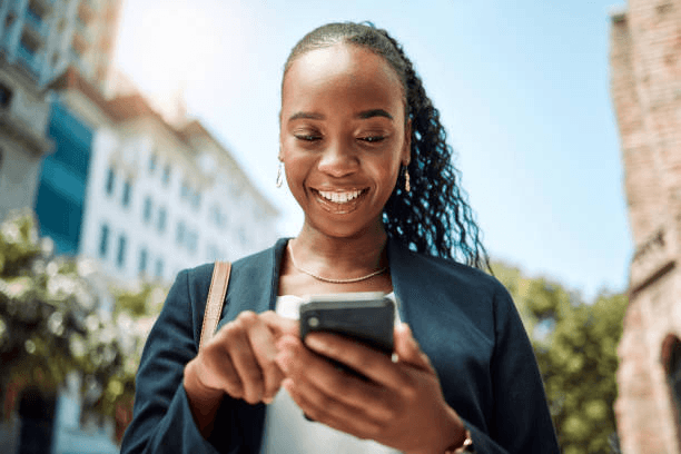 Professional reviewing SMS on her phone
